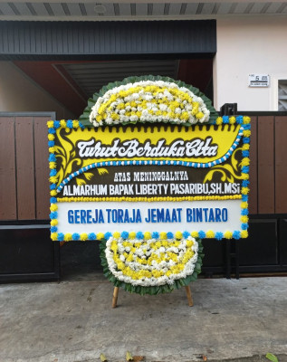 Papan Bunga Duka di Kepuharjo